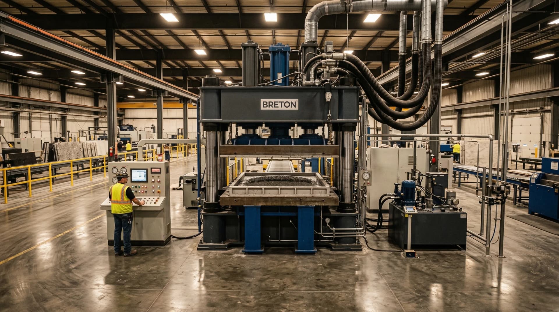 Distinctive Form — the Bretonstone vacuum vibrocompression process. A large industrial hydraulic press inside a modern quartz countertop manufacturing facility, steel mold tray containing raw quartz aggregate mixture with vacuum hoses connected to the press chamber, demonstrating the patented Italian compression technology that transforms crushed quartz crystals and polymer resins into dense, non-porous engineered stone slabs.