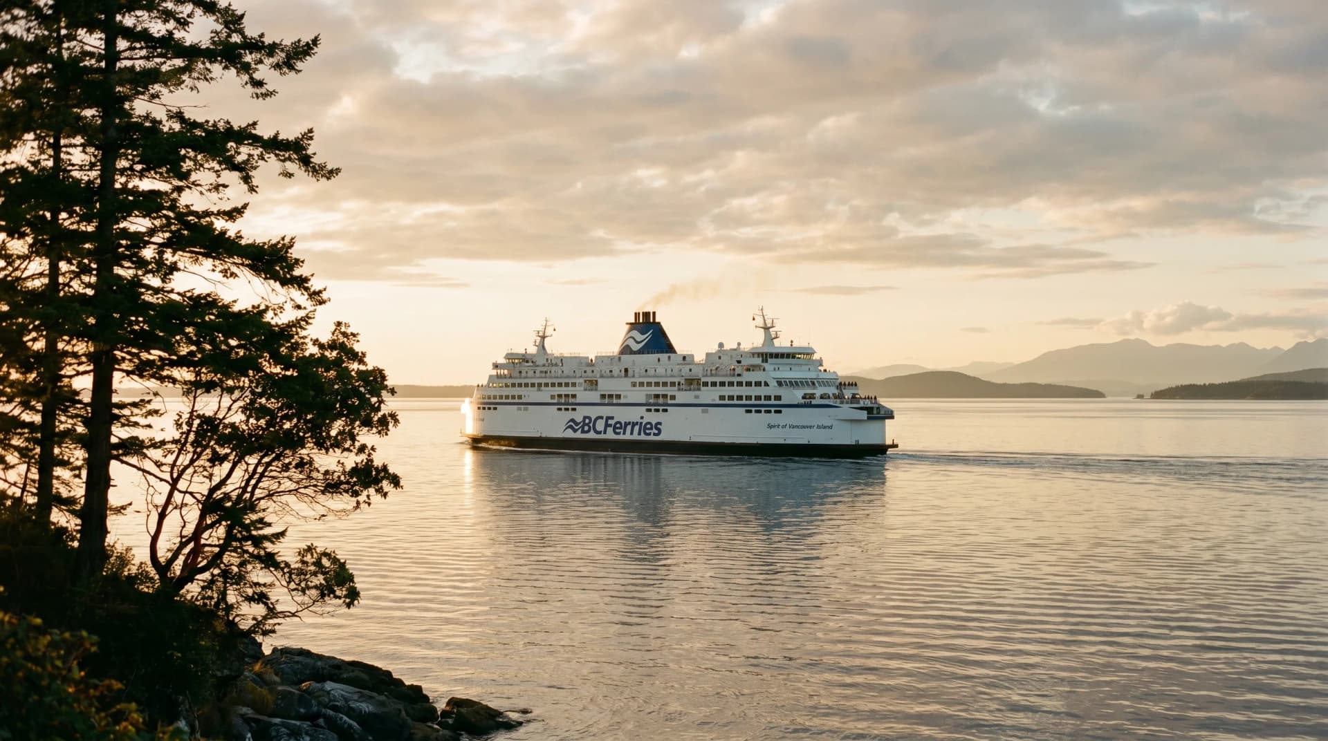 A BC Ferries vessel crossing the Strait of Georgia at golden hour from the Vancouver Island side — the ferry-dependent supply chain Distinctive Form plans around for Victoria projects